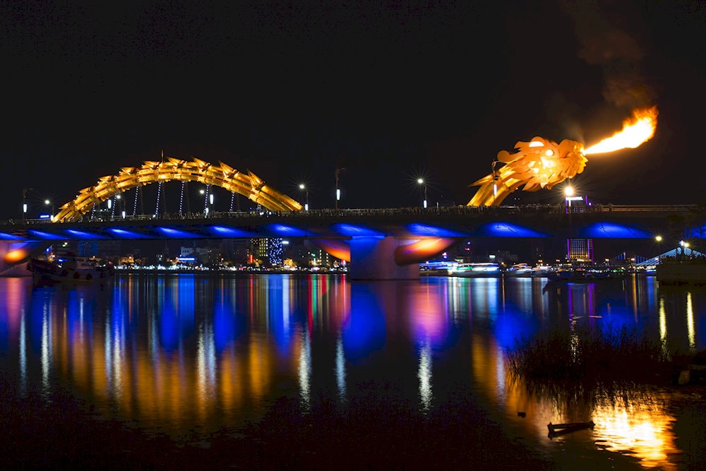 The Dragon Bridge dazzles at night with its ever-changing colors